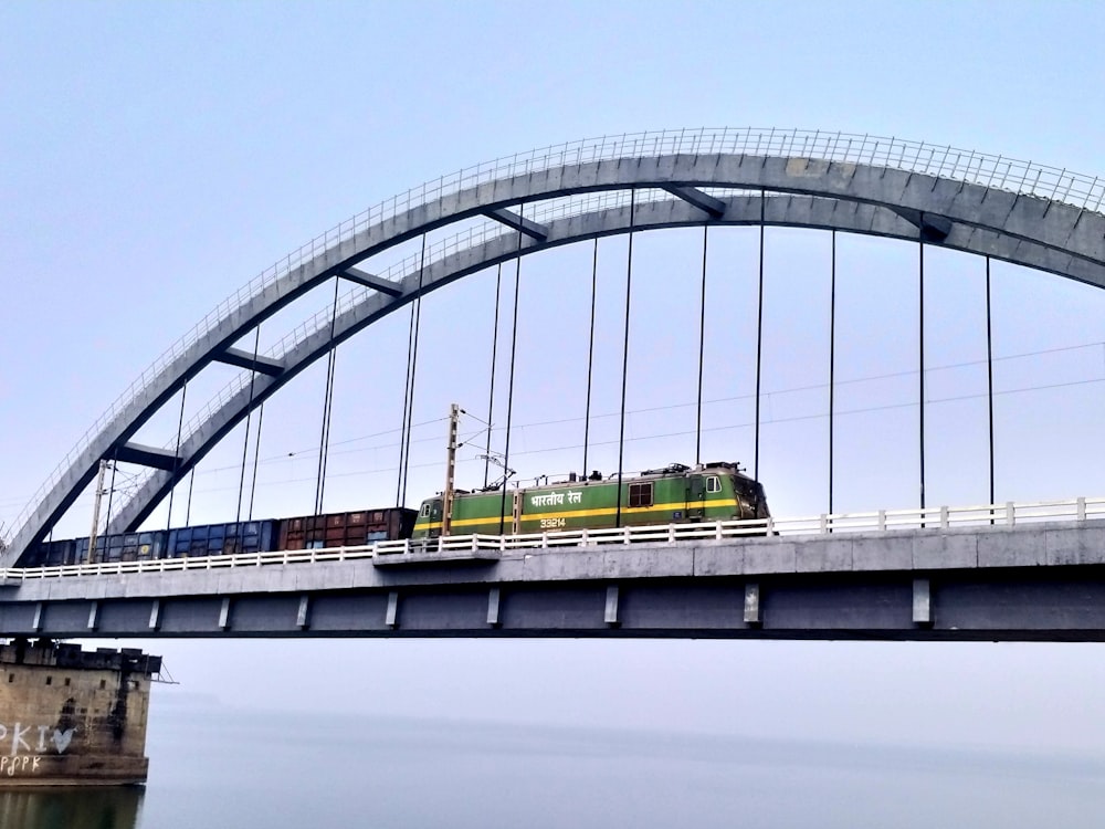 a train traveling over a bridge over a body of water