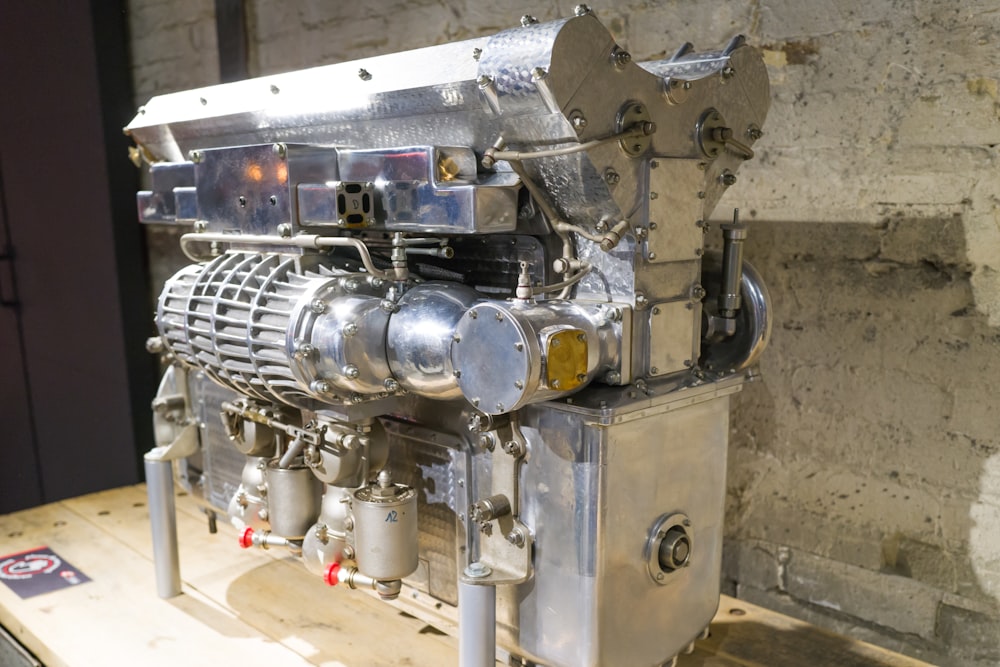 a large engine sitting on top of a wooden table