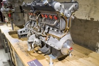 a large engine sitting on top of a wooden table