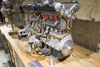 a large engine sitting on top of a wooden table