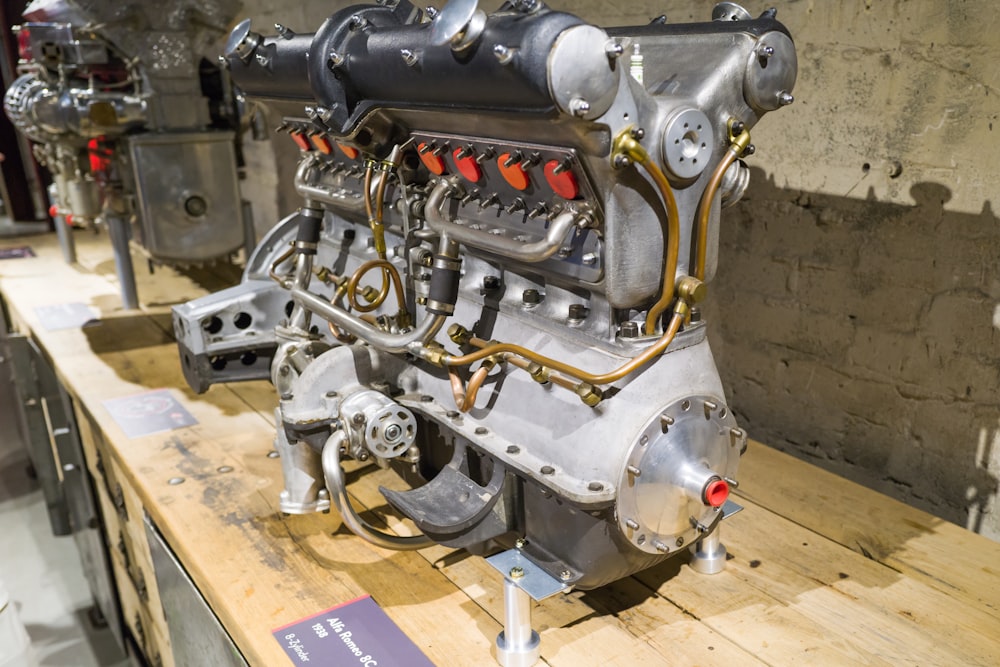 a large engine sitting on top of a wooden table