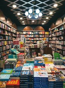 a room filled with lots of books in a library