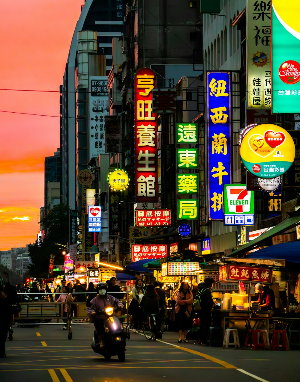 a city street filled with lots of neon signs