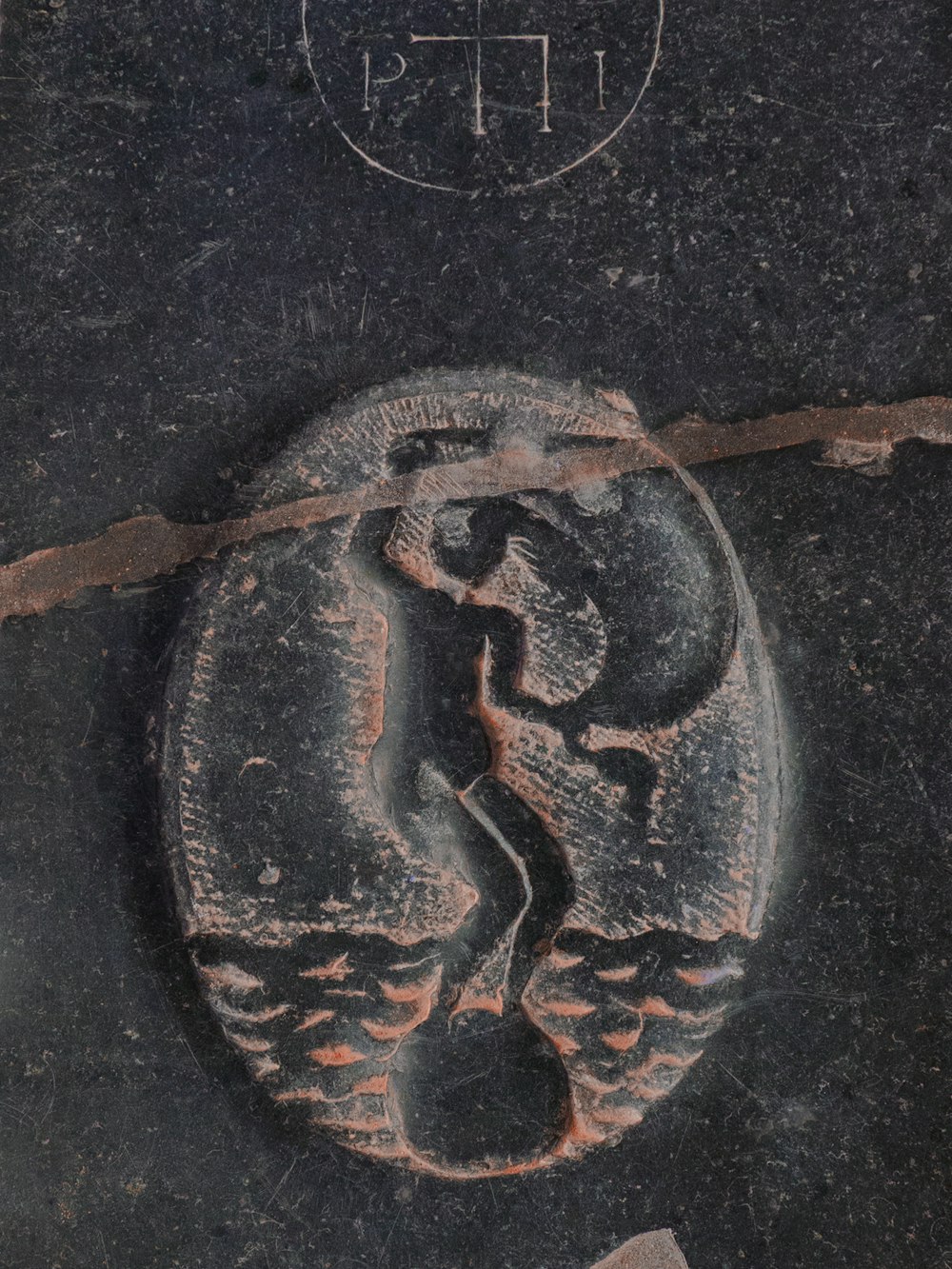 a close up of a rock with a drawing on it