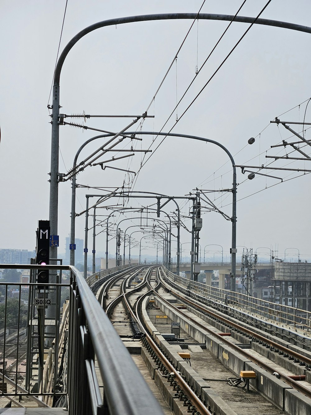 a view of a train track from a platform