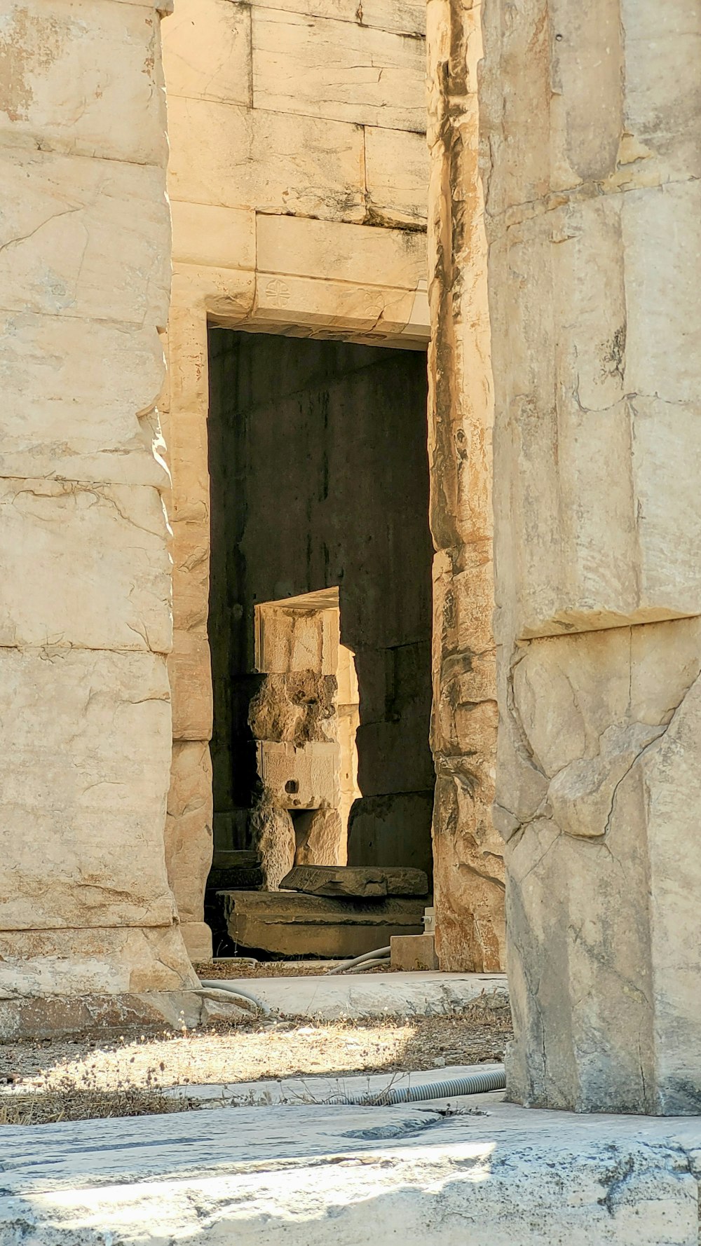 a stone building with a door and a window