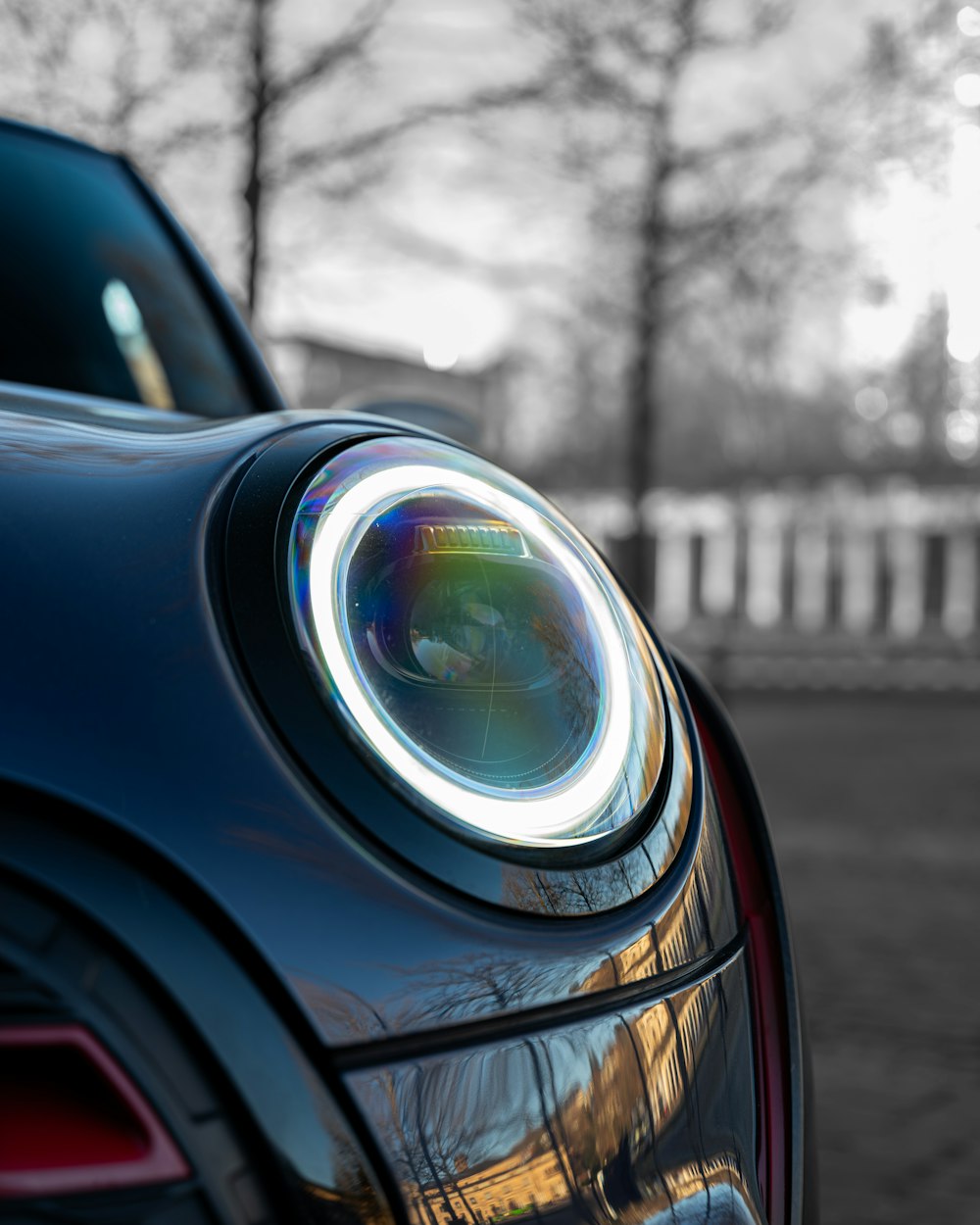 a close up of a car with its lights on