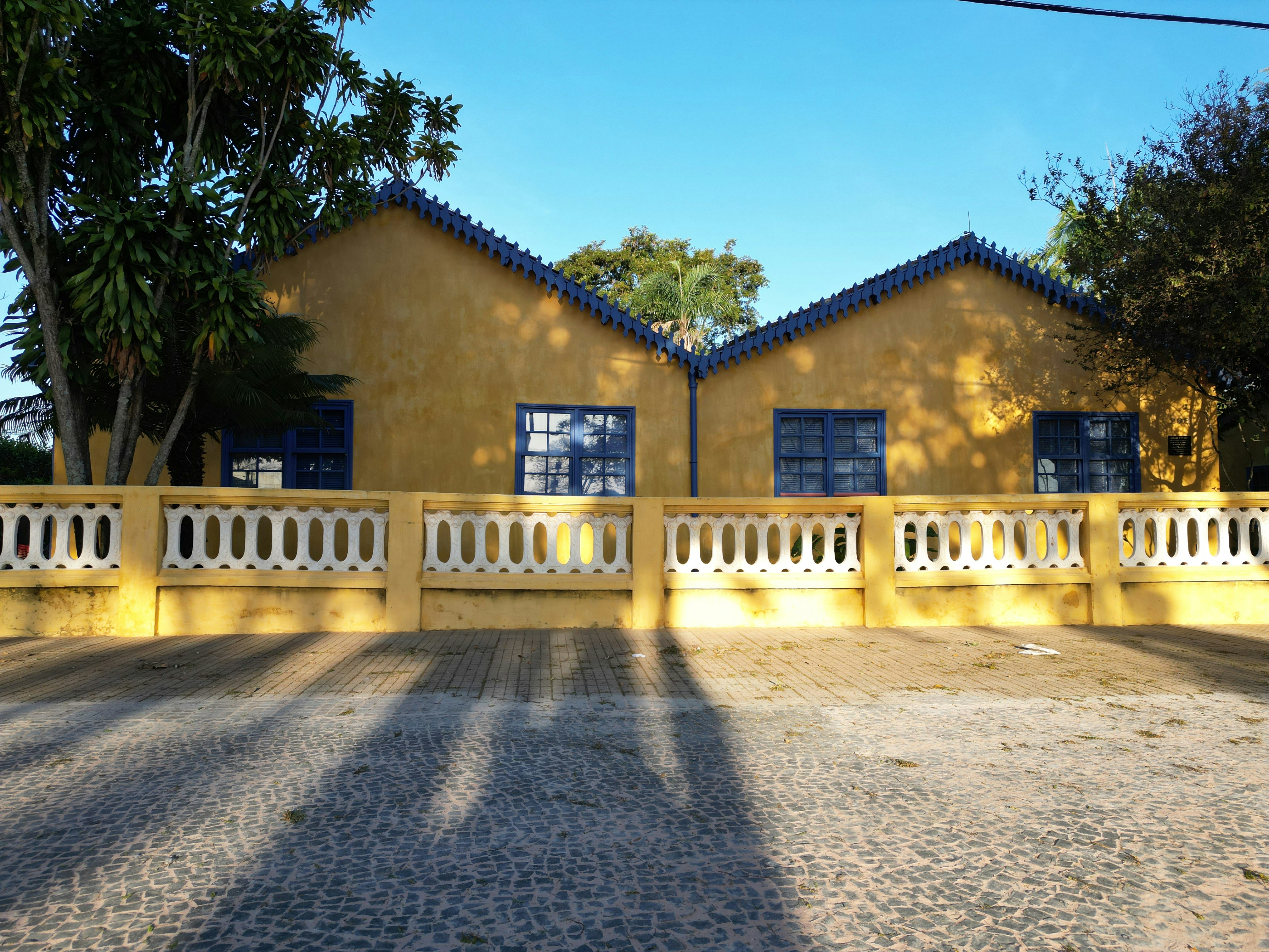 the shadow of a person standing in front of a house