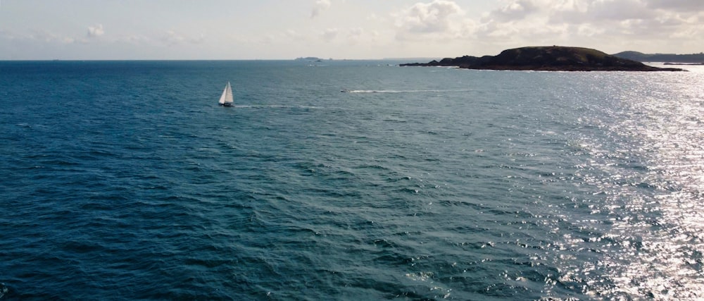 a sailboat in the middle of a large body of water