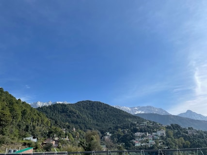 a view of a mountain range from a balcony