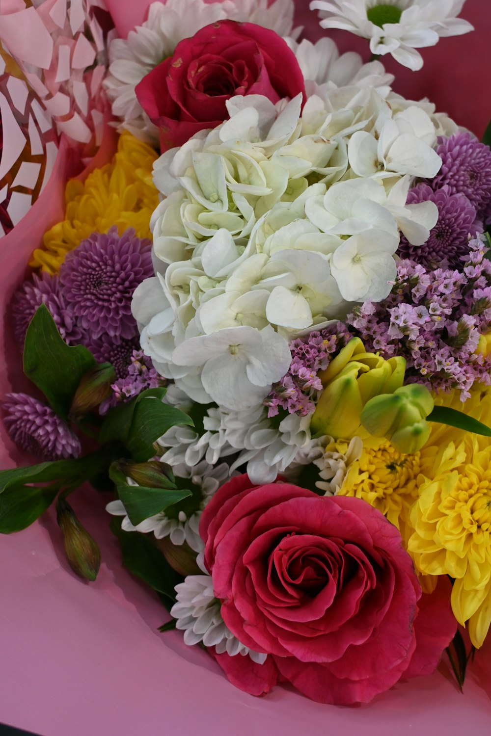 a bouquet of flowers sitting on top of a table