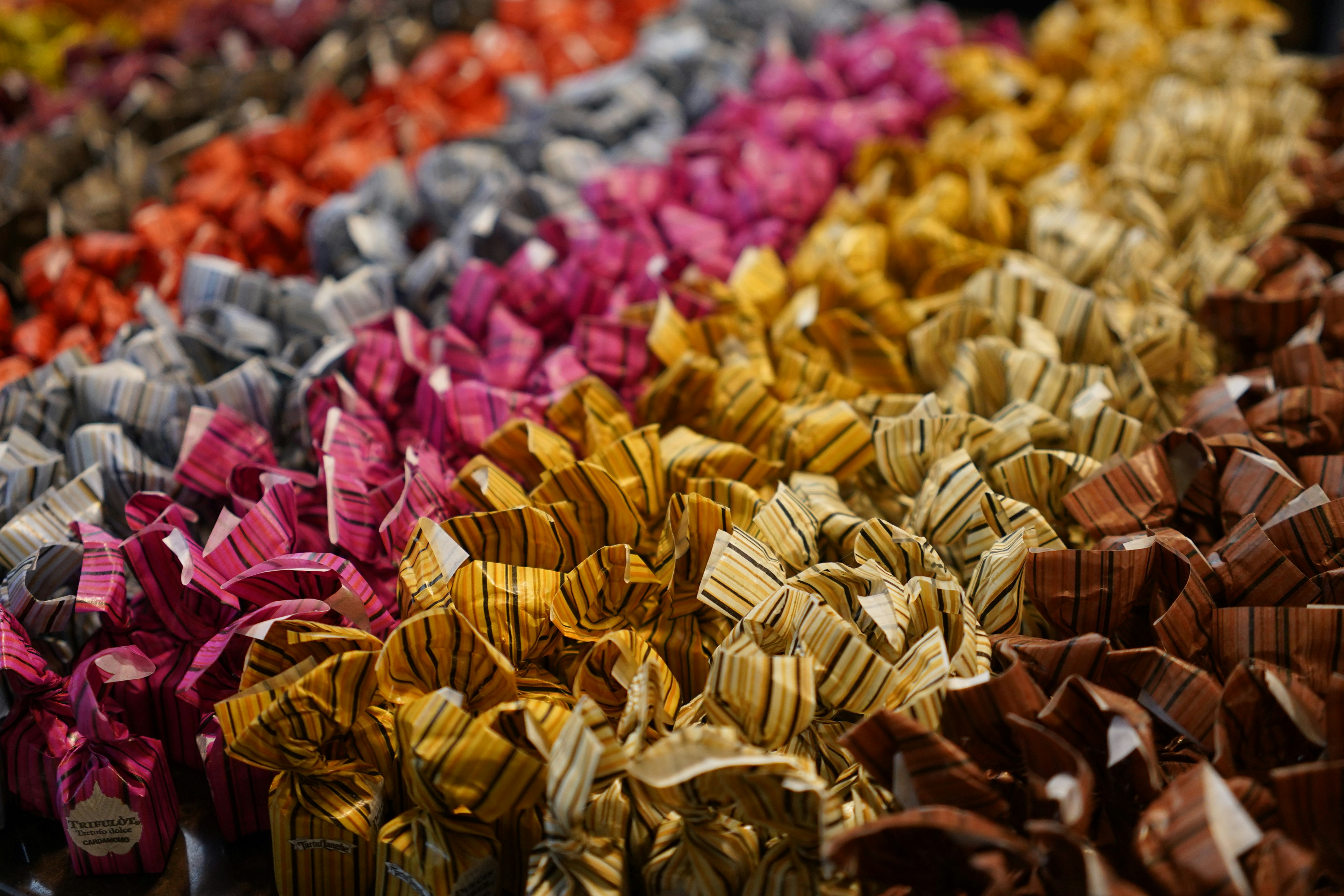 a bunch of different colored bows on a table
