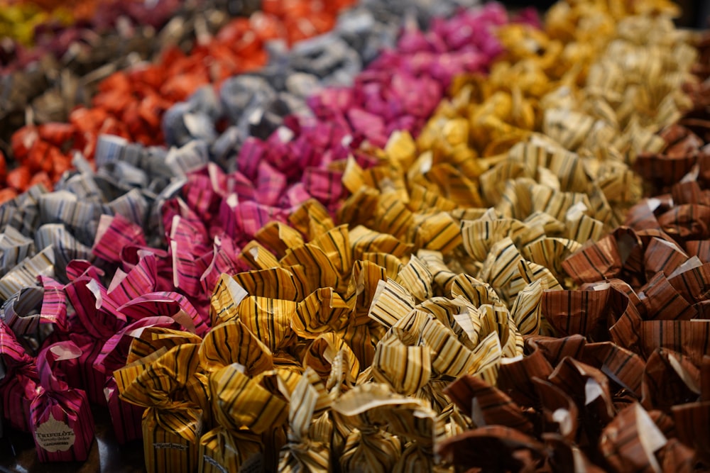 a bunch of different colored bows on a table