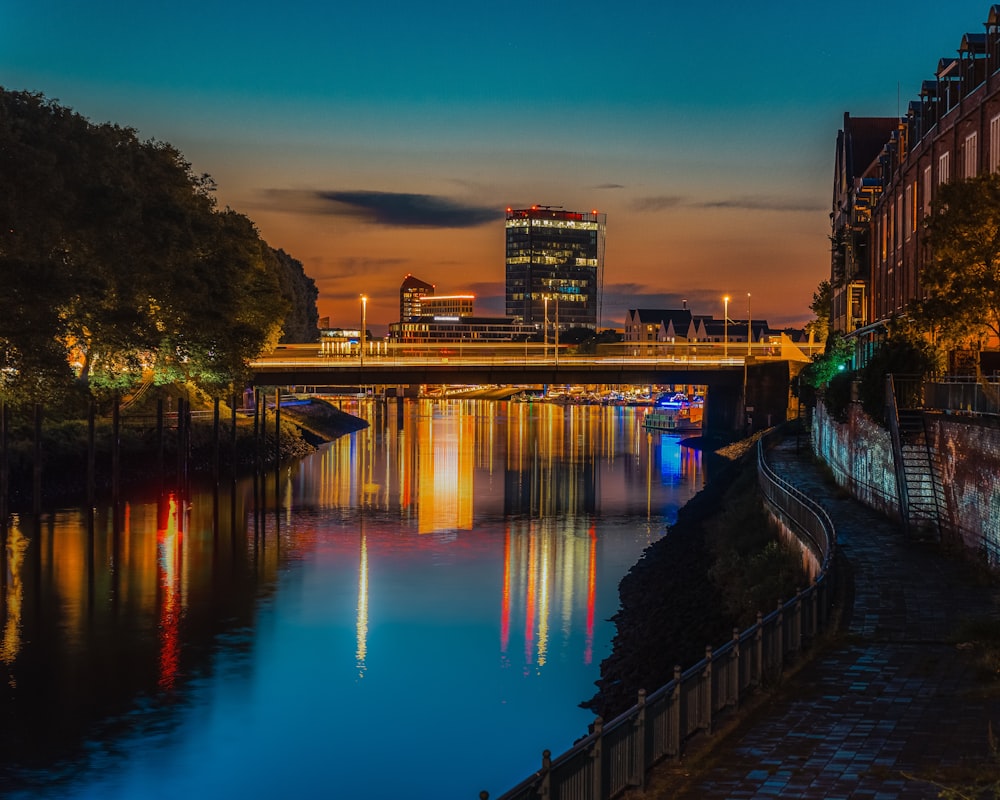 a river with a bridge in the background