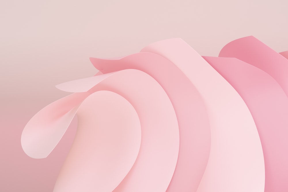 a pink abstract background with curved shapes