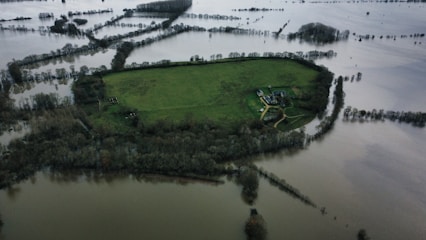an aerial view of a flooded area of land