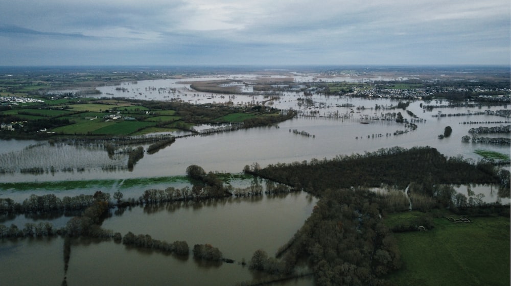 an aerial view of a flooded area in a rural area