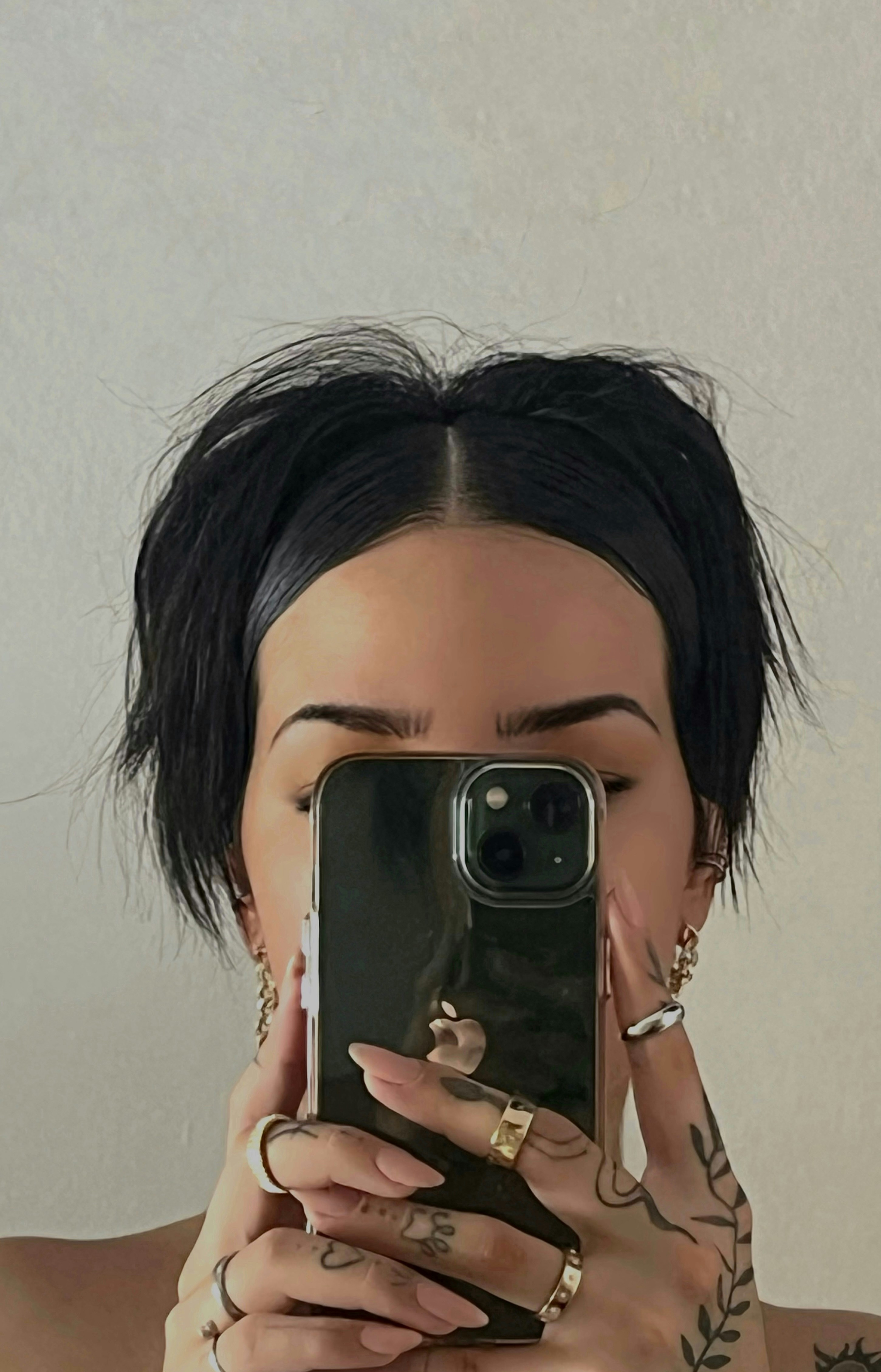a woman taking a selfie with her phone