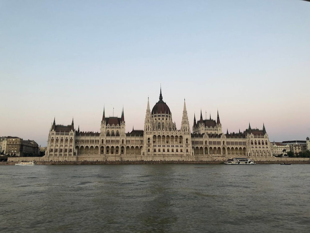 a large building sitting on top of a body of water