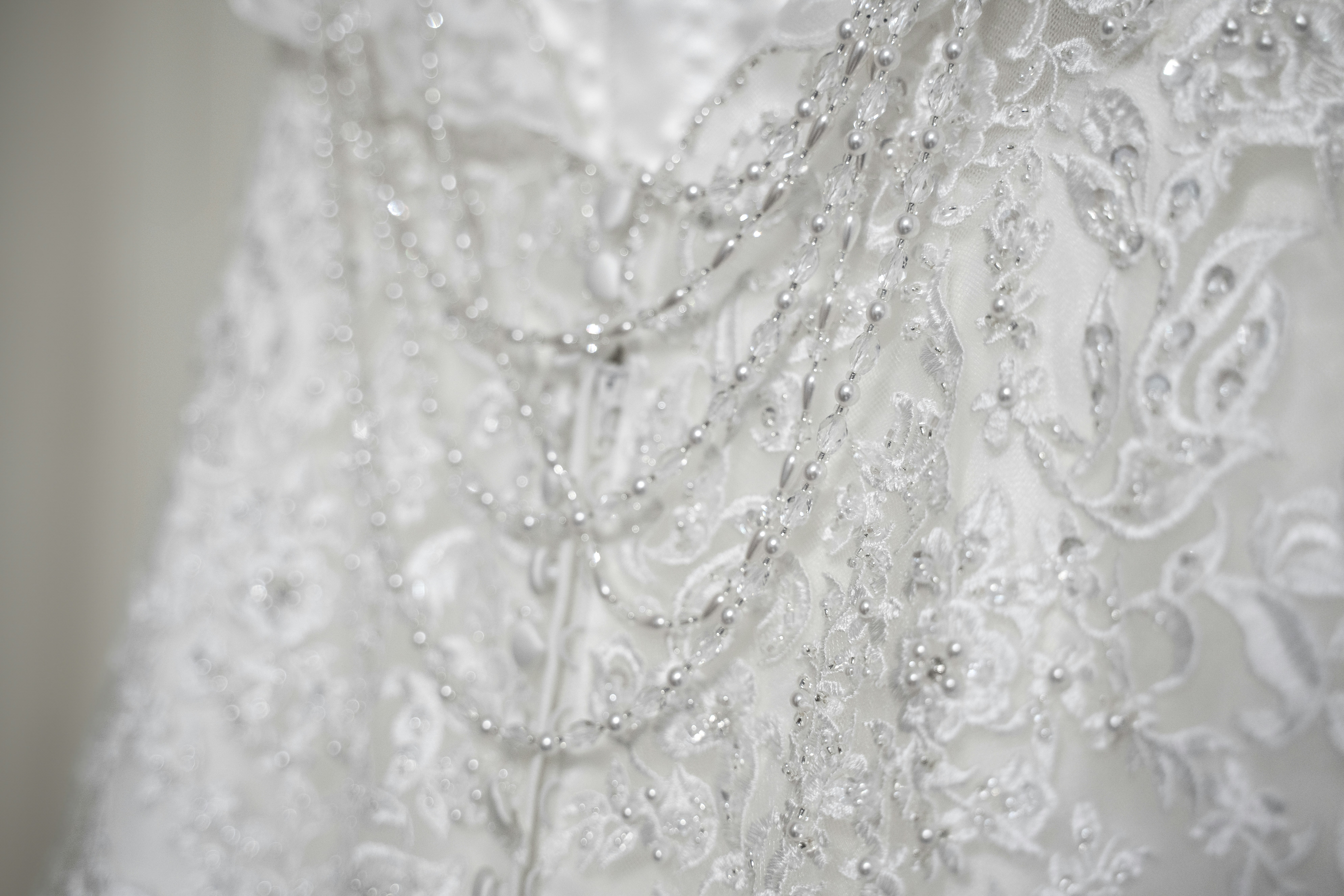 wedding dress with intricate lace and beading details - wedding dress pressing cost