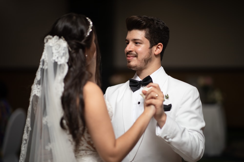 a man and a woman standing next to each other