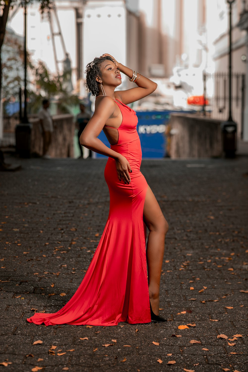 a woman in a red dress posing for a picture