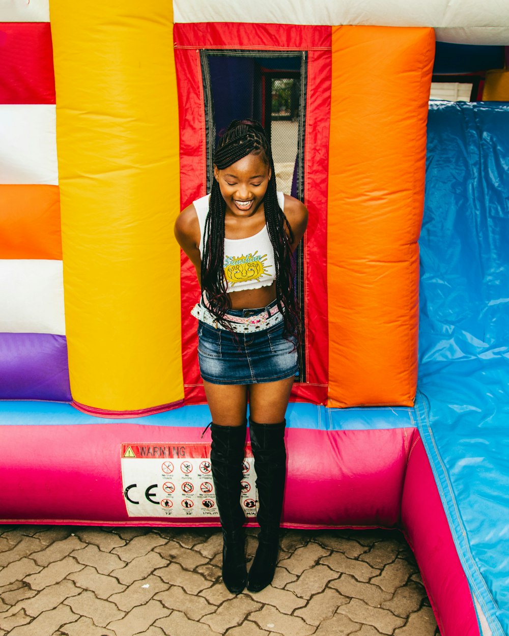 a young girl standing in a bouncy castle