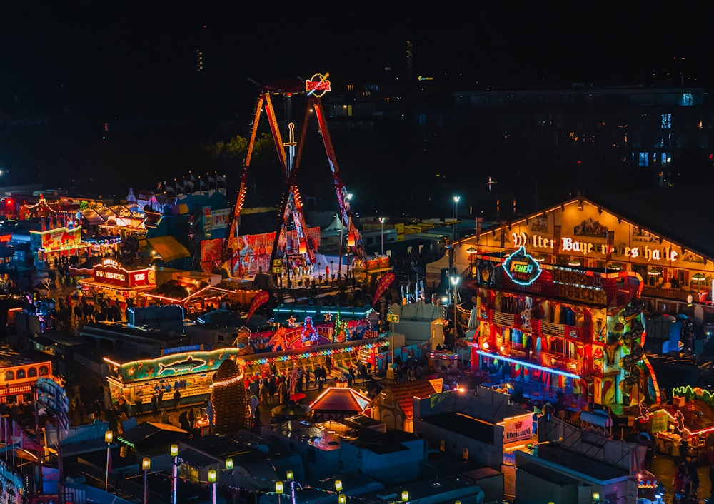 an aerial view of a carnival at night