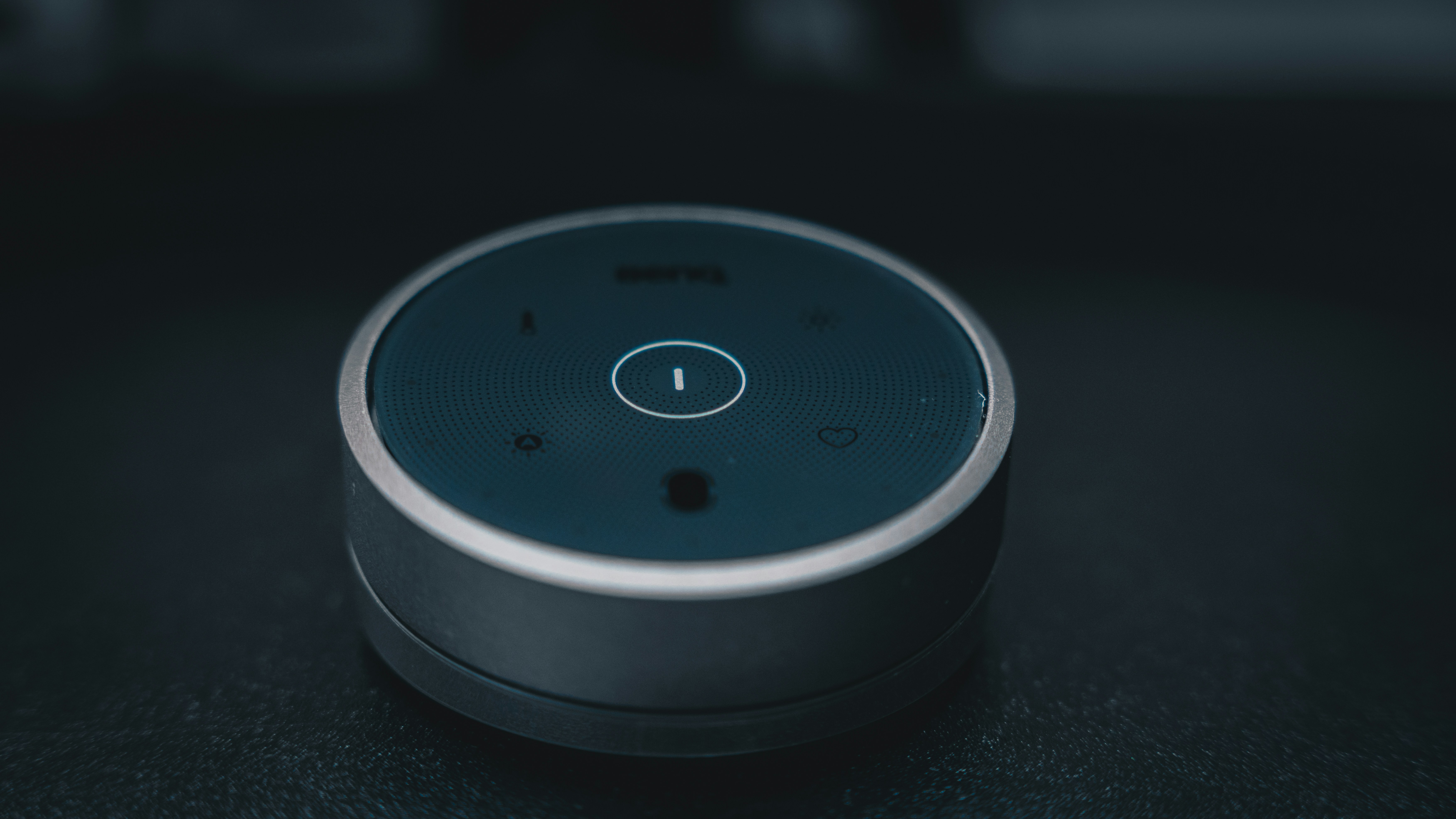 Alt text: Close-up of a smart device on a table, showcasing Branimo technology.