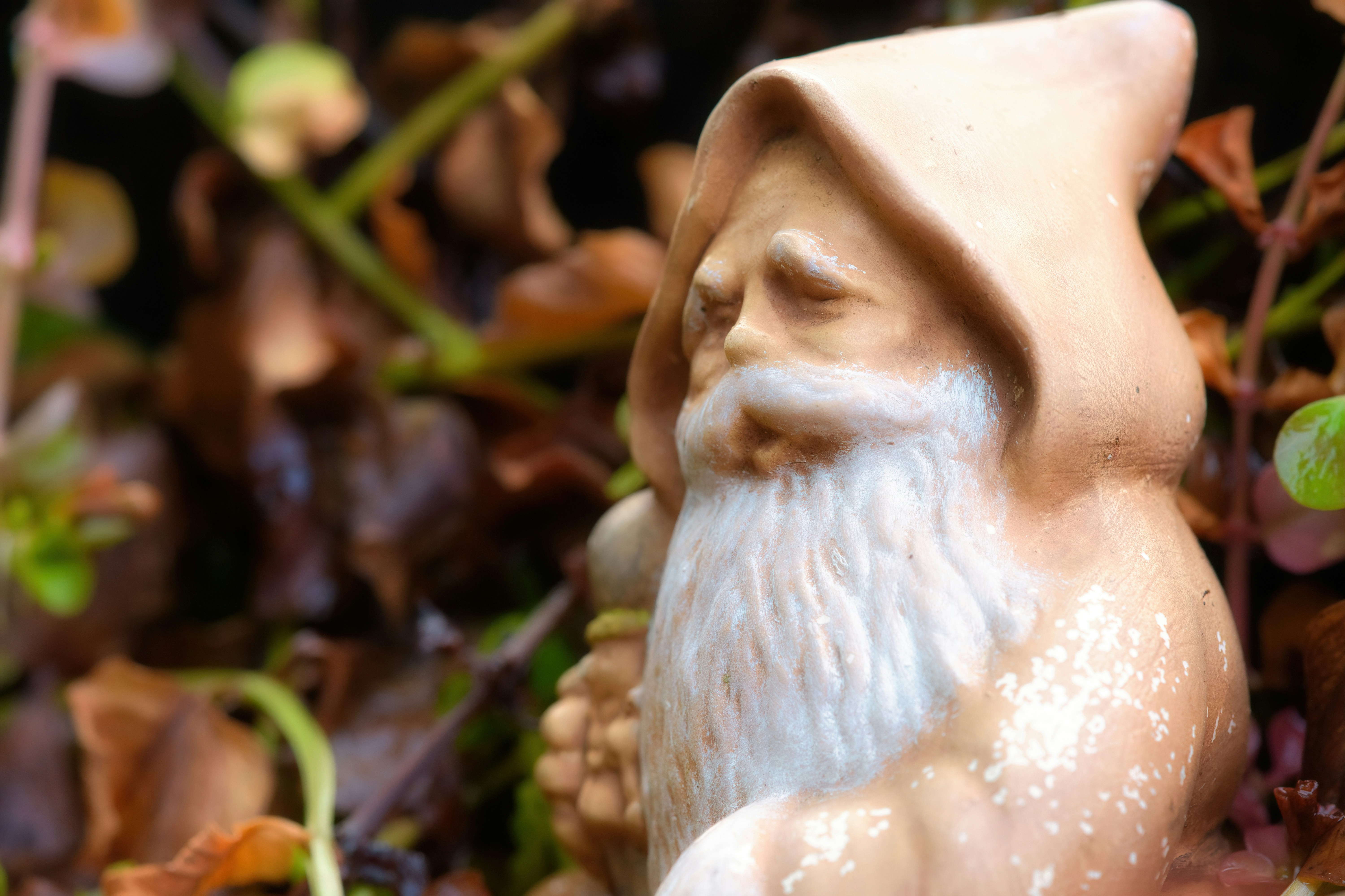a close up of a statue of a gnome