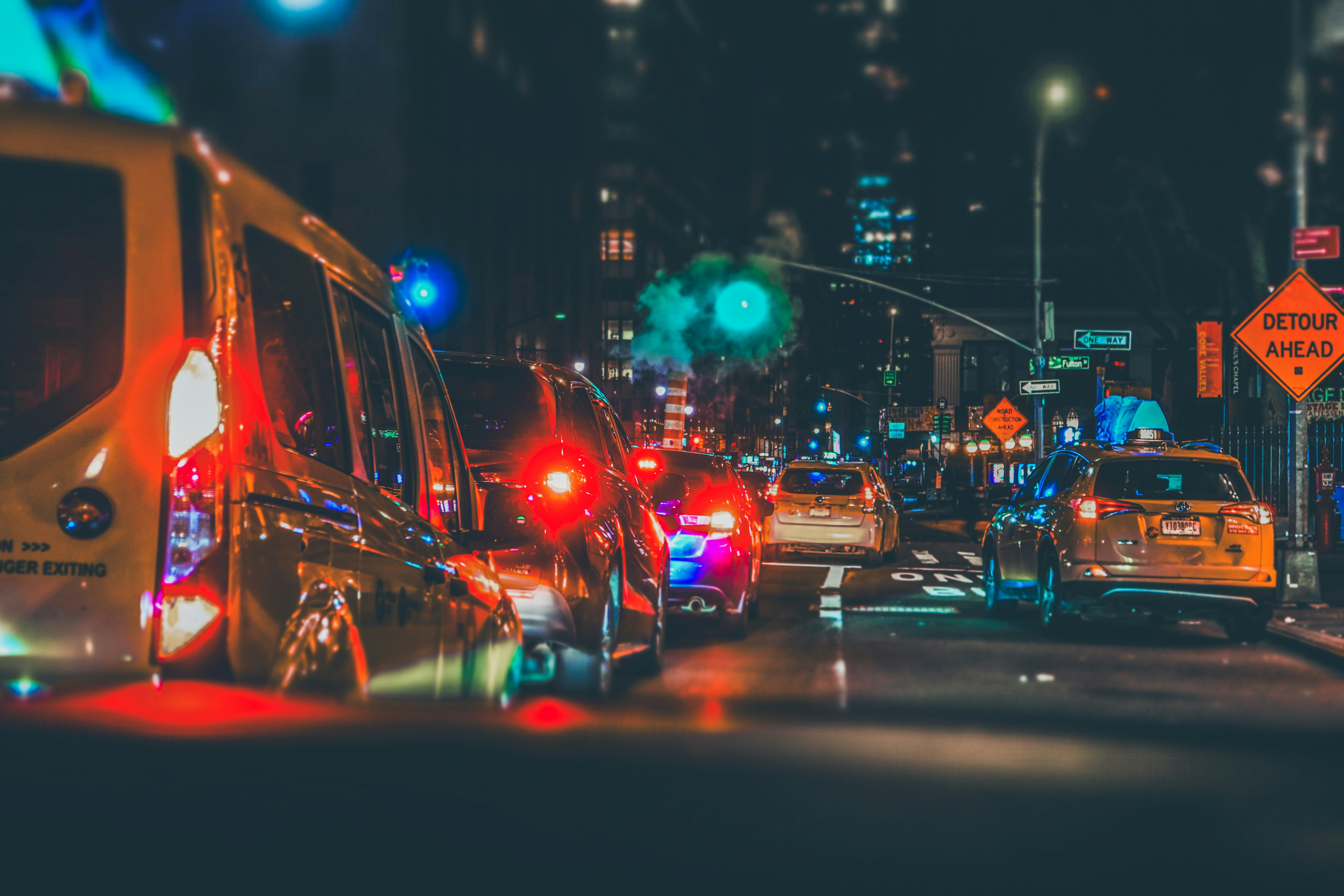 A city street filled with lots of traffic at night photo – Free New ...