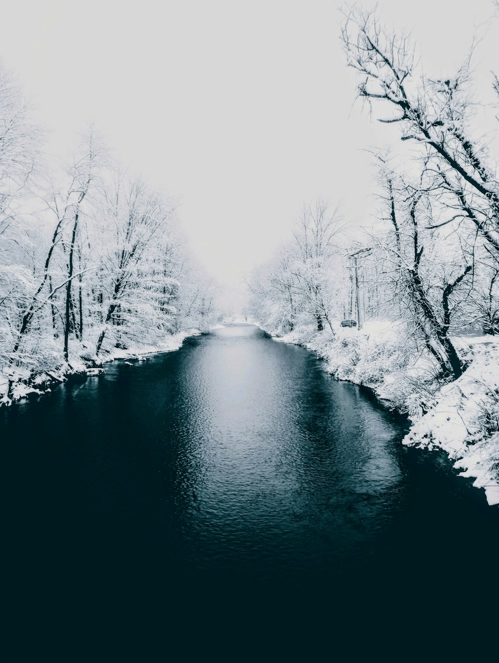 a river running through a snow covered forest