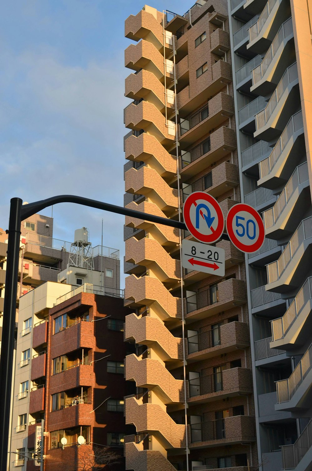 a street light with a building in the background