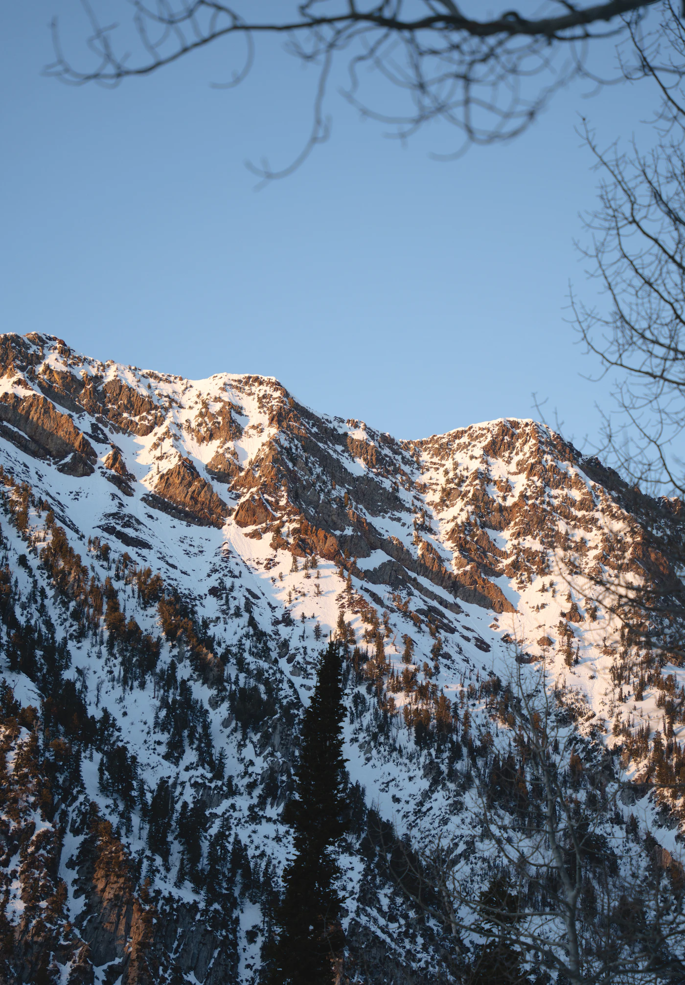 Steep snow-covered Wasatch peaks at the south end of the Salt Lake valley