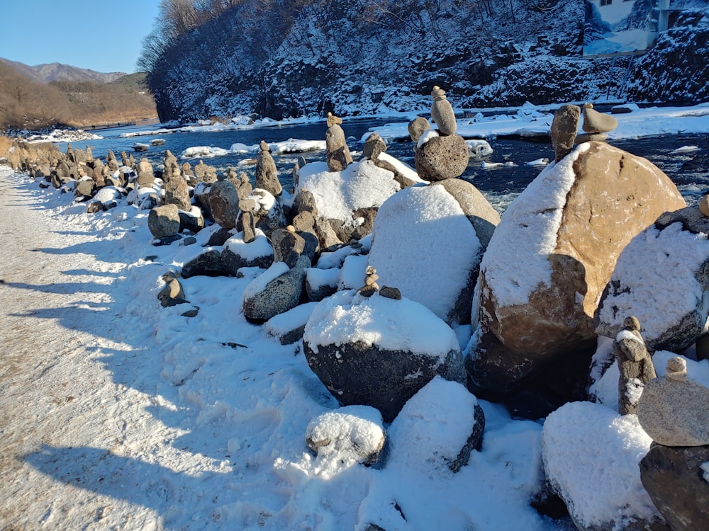 a bunch of rocks that are sitting in the snow