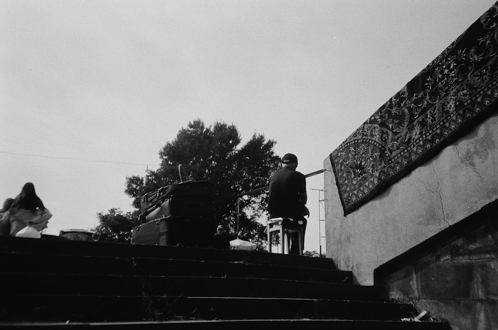 a man standing on top of a set of stairs