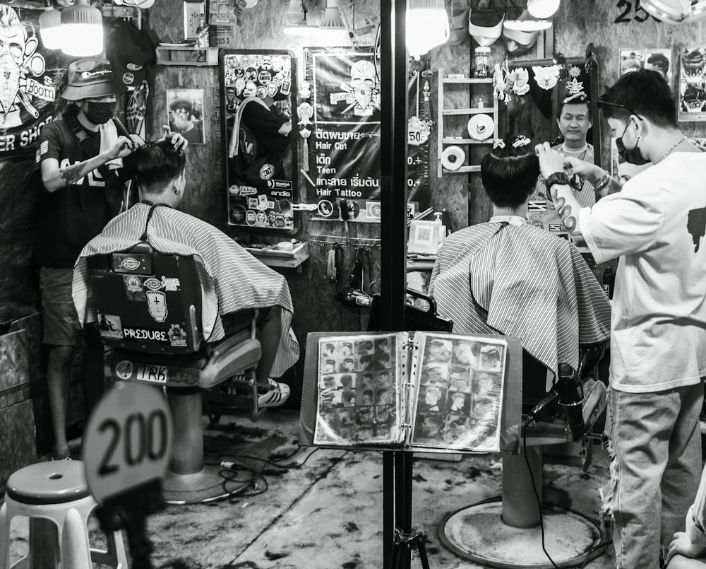 a black and white photo of a barber shop