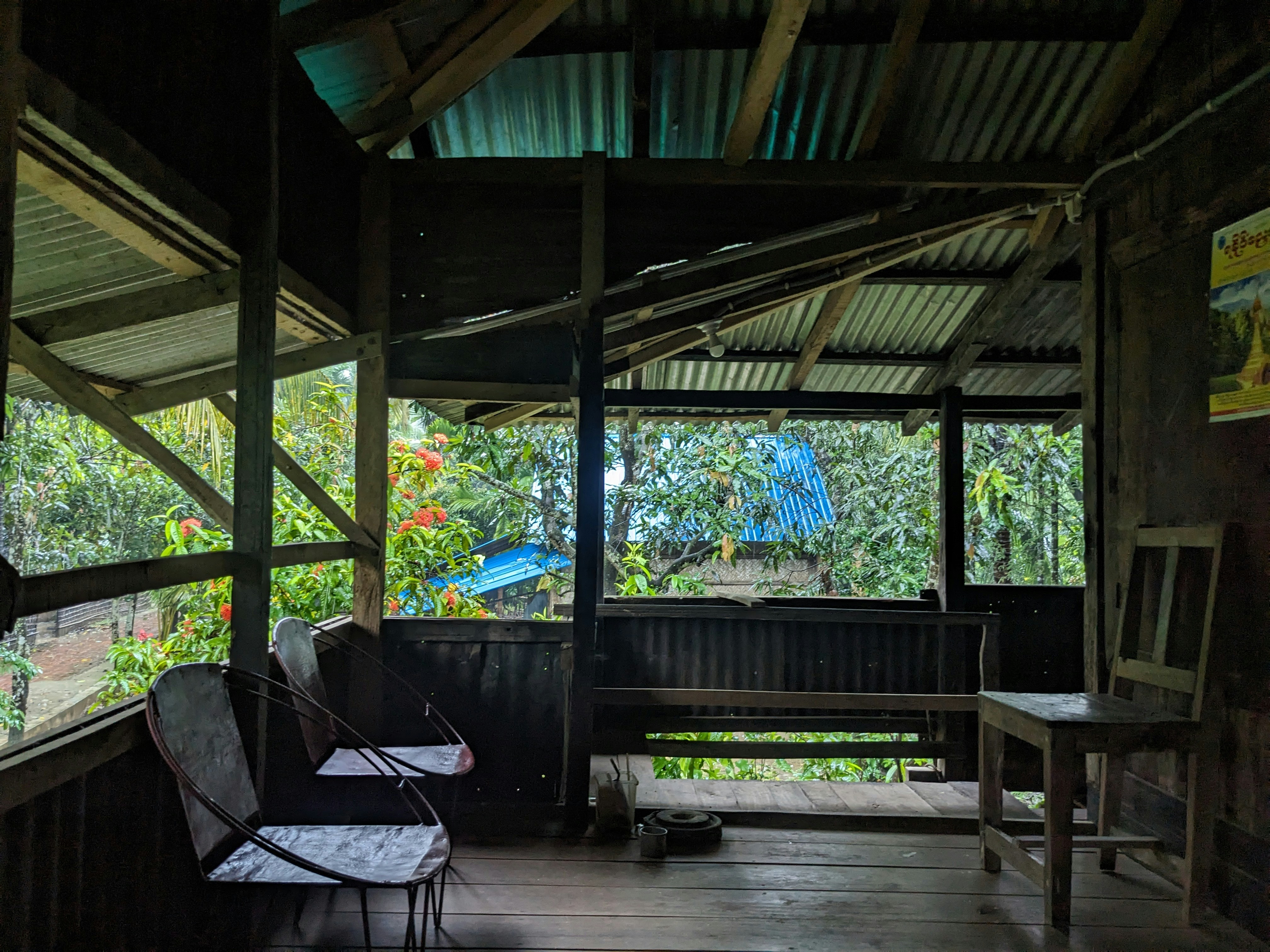 a porch with a chair and a table in it