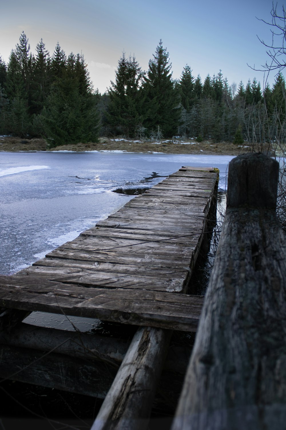 a wooden dock sitting next to a body of water