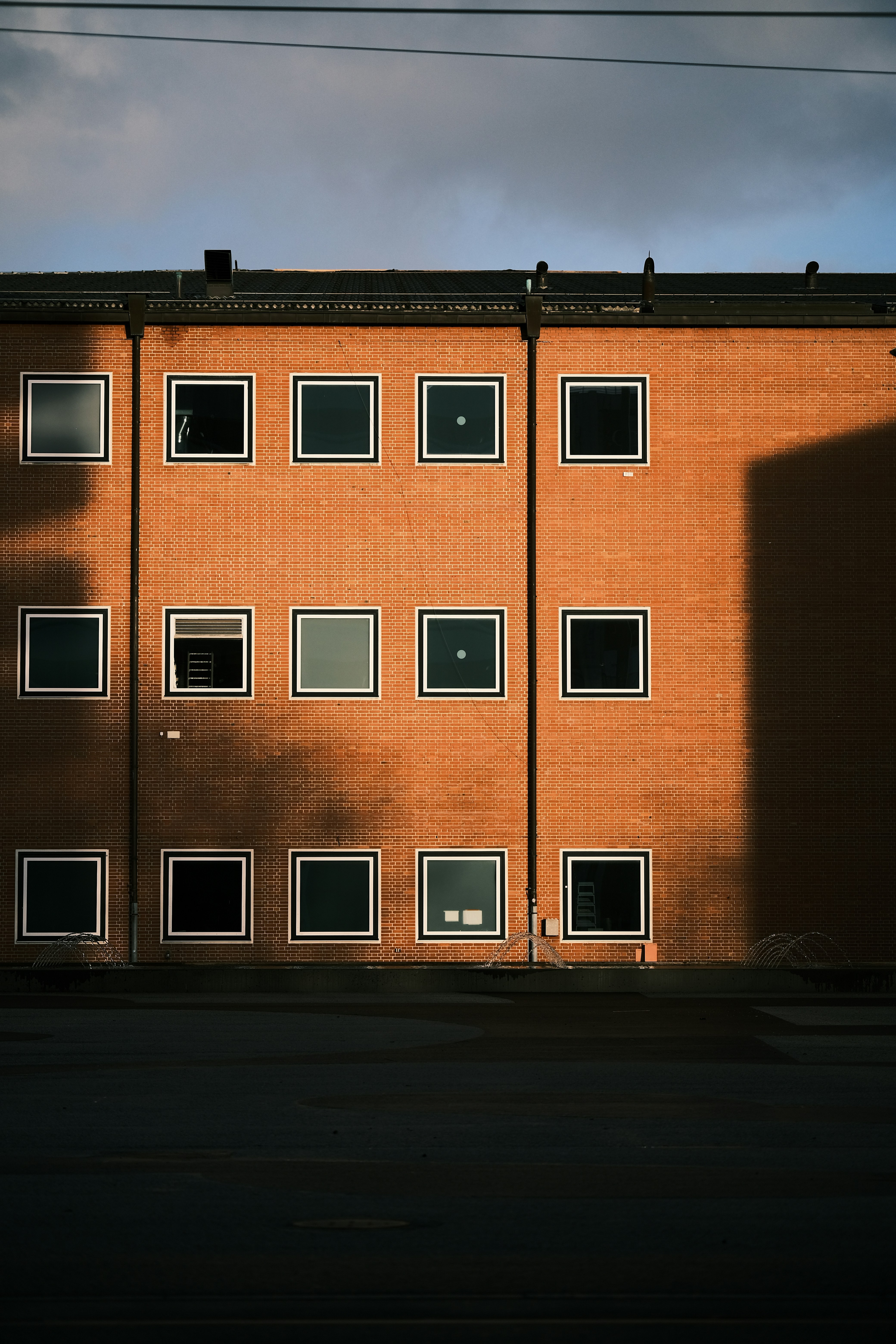 a tall brick building with lots of windows
