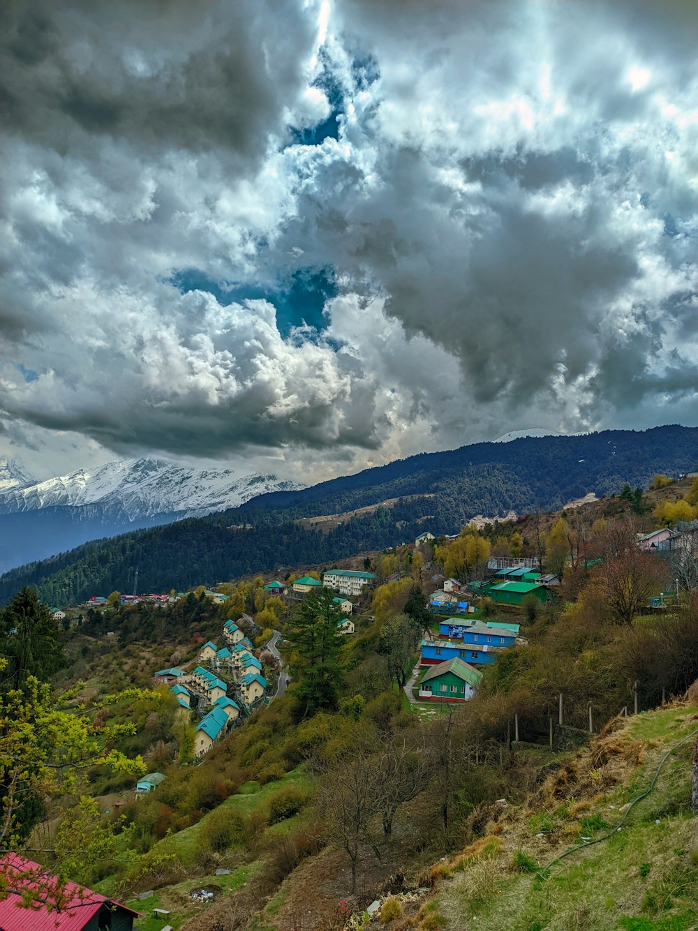 a scenic view of a town on a hill