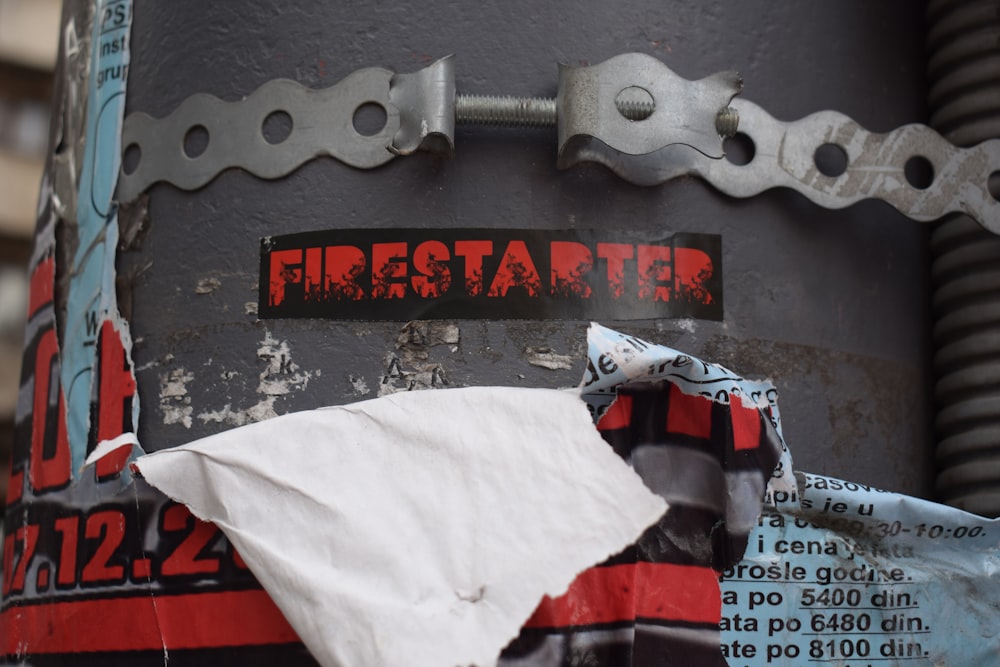 a close up of a fire hydrant with a piece of paper on it