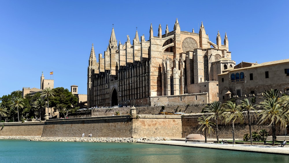 a large building sitting next to a body of water