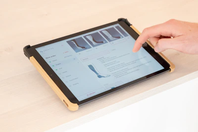 a person using a tablet on a table