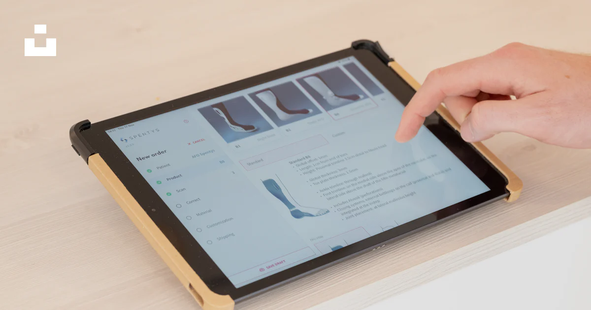 User Using Tablet A person using a tablet on a table photo – Free Wellness Image on Unsplash