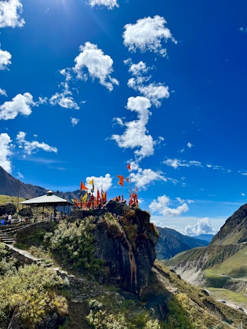 a group of people standing on top of a mountain