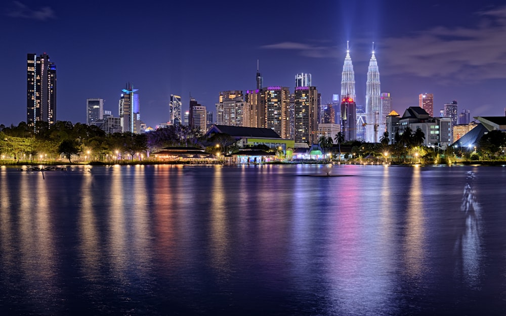 a large body of water with a city in the background