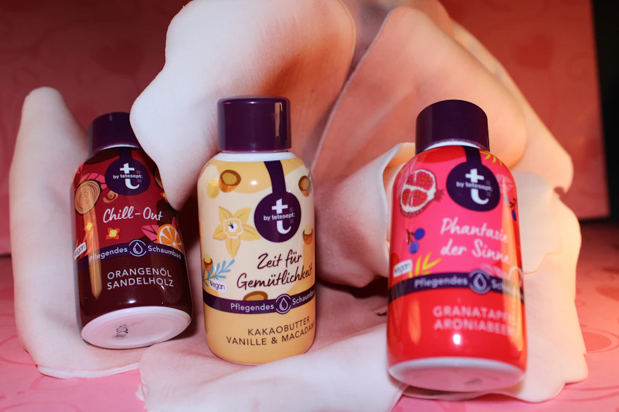 three bottles of shampoo sitting on top of a bed