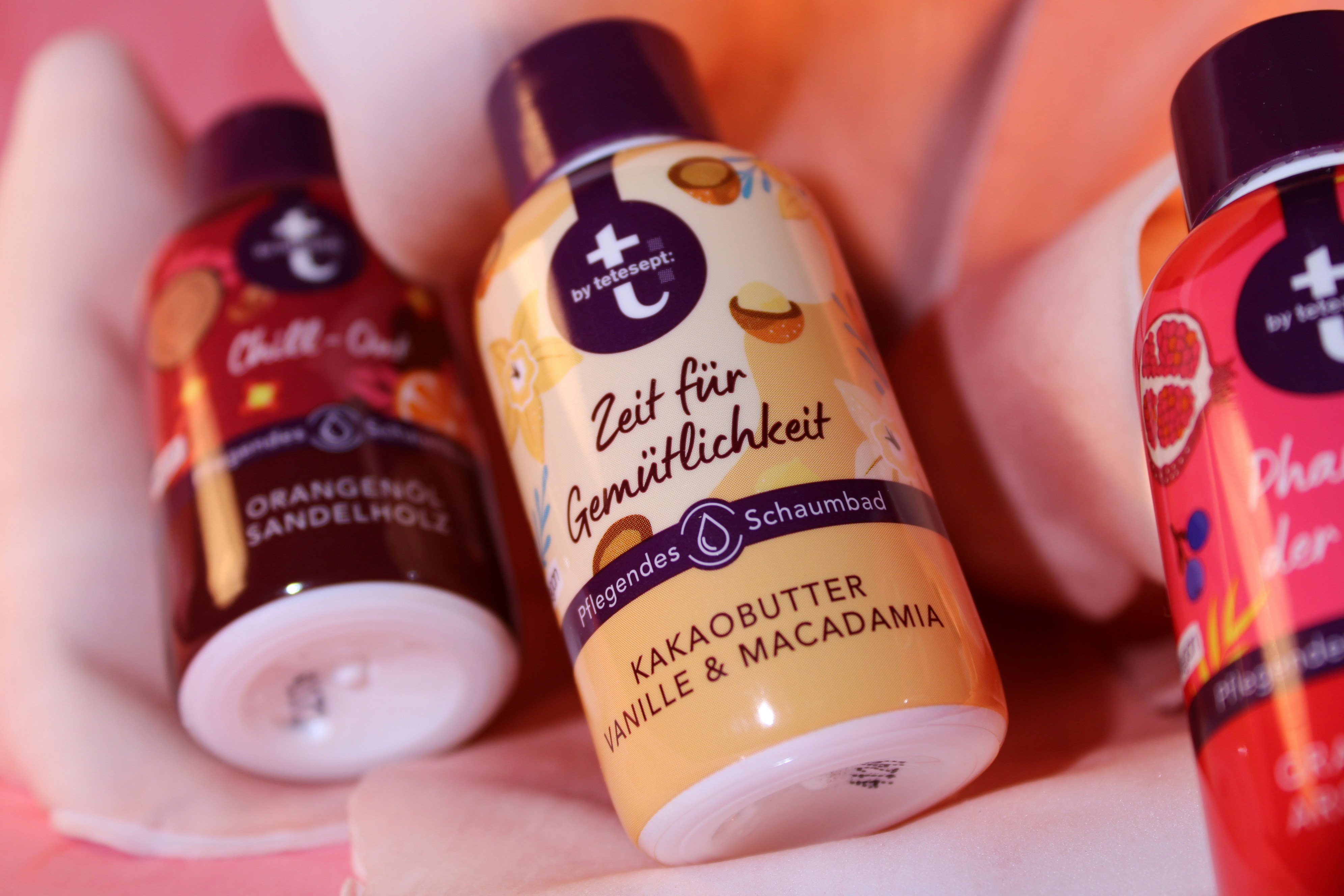 three bottles of shampoo and a bottle of lotion