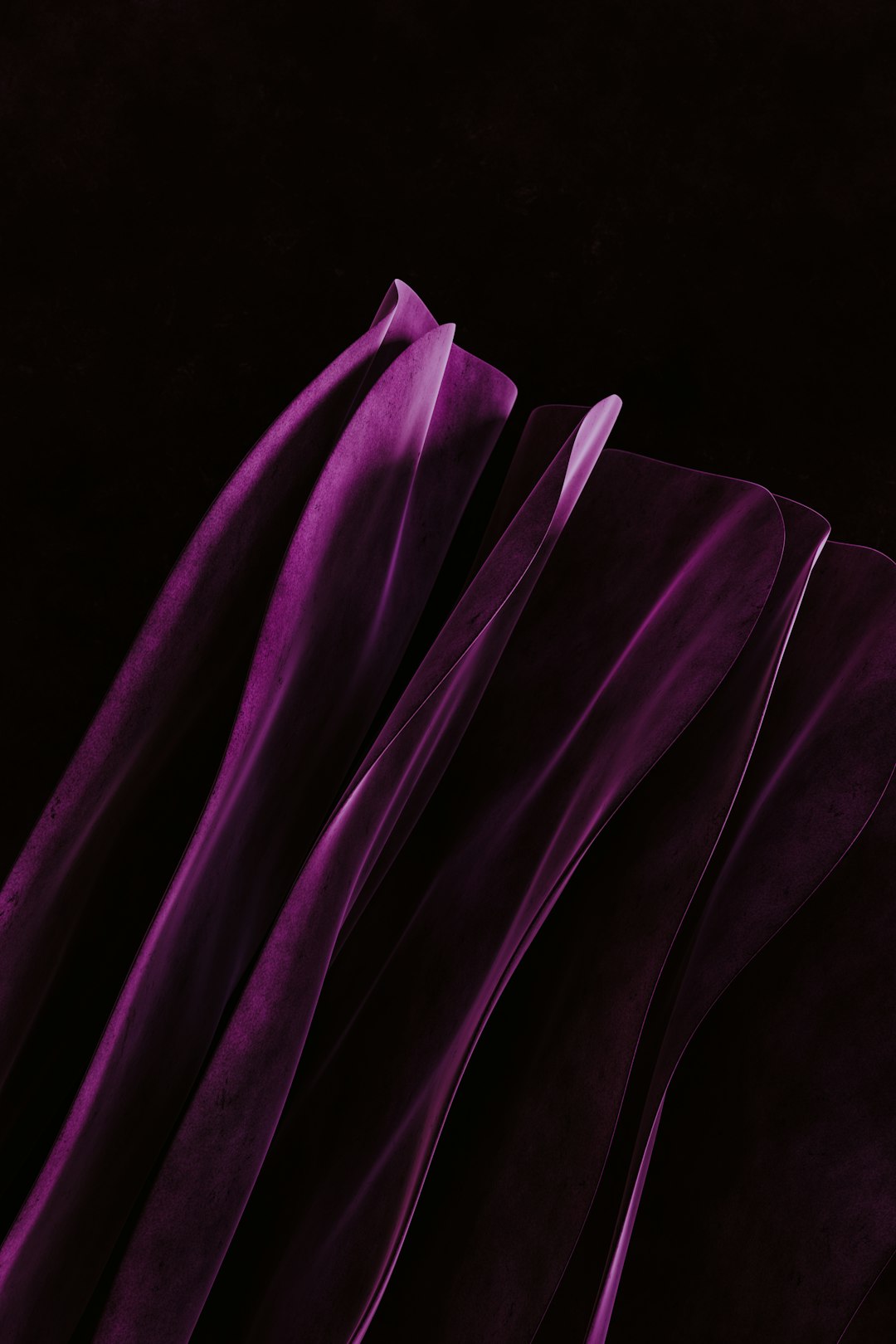 a close up of a purple cloth on a black background